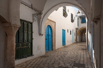 Traditional blue coloured doors in the cobbled narrow streets of the Kasbah or Medina of Tunis, a UNESCO World Heritage protected site in the capital of Tunisia, North Africa.