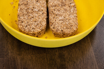 Whole wheat breakfast biscuits in brown bowl