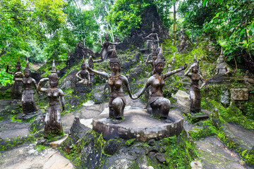 Ancient stone statues in secret Buddhism Magic Garden, Koh Samui, Thailand.