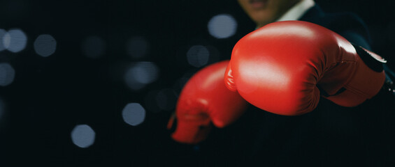 competition market strategy concept. Power of business boxing , businessman in boxing gloves on...