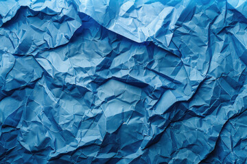 Fototapeta premium Textured abstract pattern with a crumpled paper effect in various shades of blue. Layered and tactile design ideal for contemporary art and visual backgrounds.