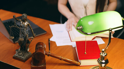 Justice and law concept. Lawyer works with laptop in court office. Concept of legal work, litigation.