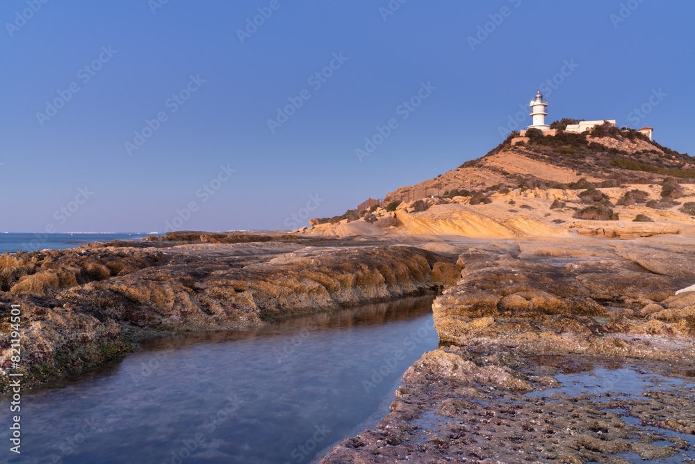 Sticker view of the cabo de la huerta lighthouse at sunrise