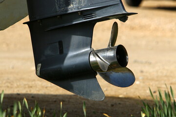 The propeller of a motor boat at the pier in the seaport.