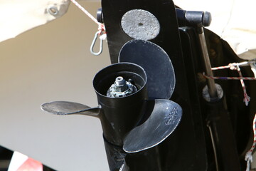 The propeller of a motor boat at the pier in the seaport.