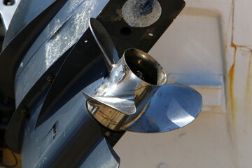 The propeller of a motor boat at the pier in the seaport.
