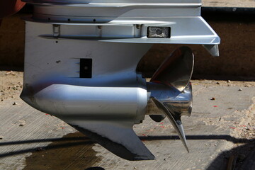 The propeller of a motor boat at the pier in the seaport.