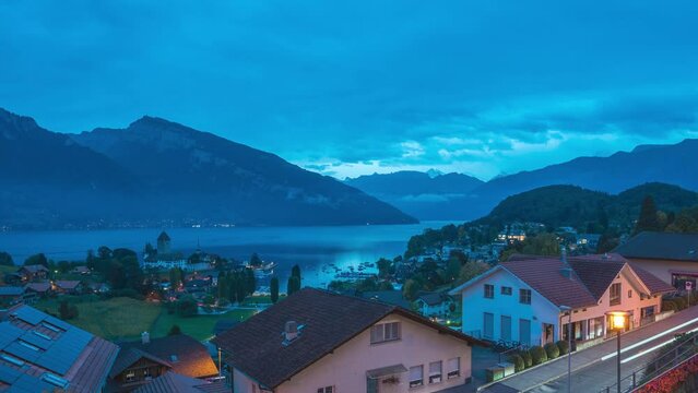 Spiez Switzerland time lapse, city skyline night to day at Spiez town and Lake Thun (Thunersee)