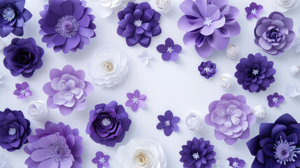 A collection of purple and white paper flowers arranged in a decorative pattern on a light background.
