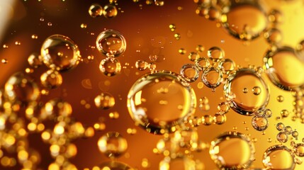 A close up of bubbles in a liquid with a golden hue, appetizing beer background