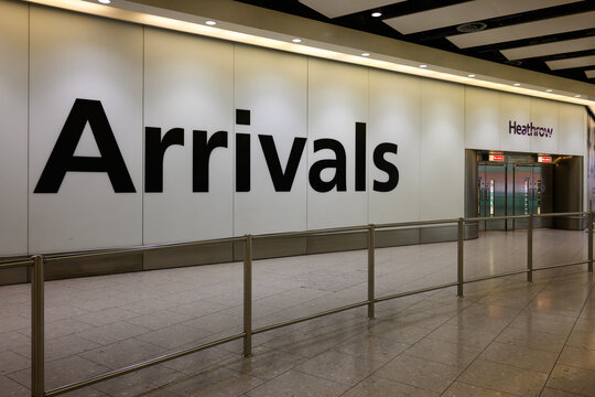 London, UK - March 22, 2024; Empty arrivals hall at London Heathrow airport with large iconic sign on wall