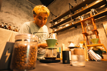 Professional Barista Prepares Fresh Cappuccino in a Busy Cafe: Closeup of Hands Skillfully Using...