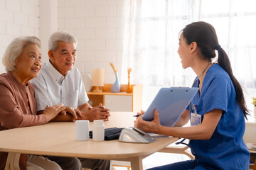 Obraz premium nursing home assistance in health insurance business concept, asian woman doctor or nurse caregiver support health care to elderly senior patient person, caretaker in medicals care recovery service