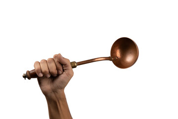 Black male hand holding a brass vintage kitchen ladle on white background