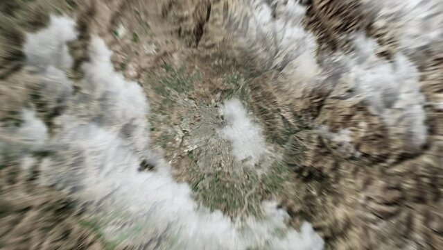 Zooming on Santiago, Chile. Earth zoom in from outer space to city. The animation continues by zoom out through clouds and atmosphere into space. View of the Earth at night. Images from NASA. 4K
