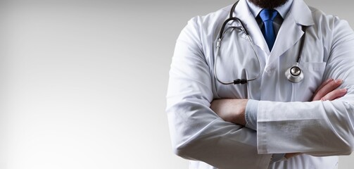 Man doctor in white coat on medical background