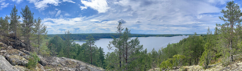 Elevated View of Ladoga Lake with Pine Trees and Rocky Terrain