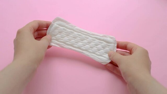 Daily feminine sanitary pad isolated on pink background. Menstrual cycle