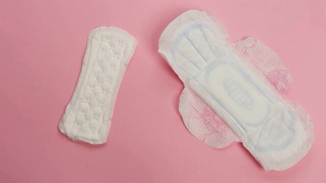 Daily feminine sanitary pad isolated on pink background. Menstrual cycle