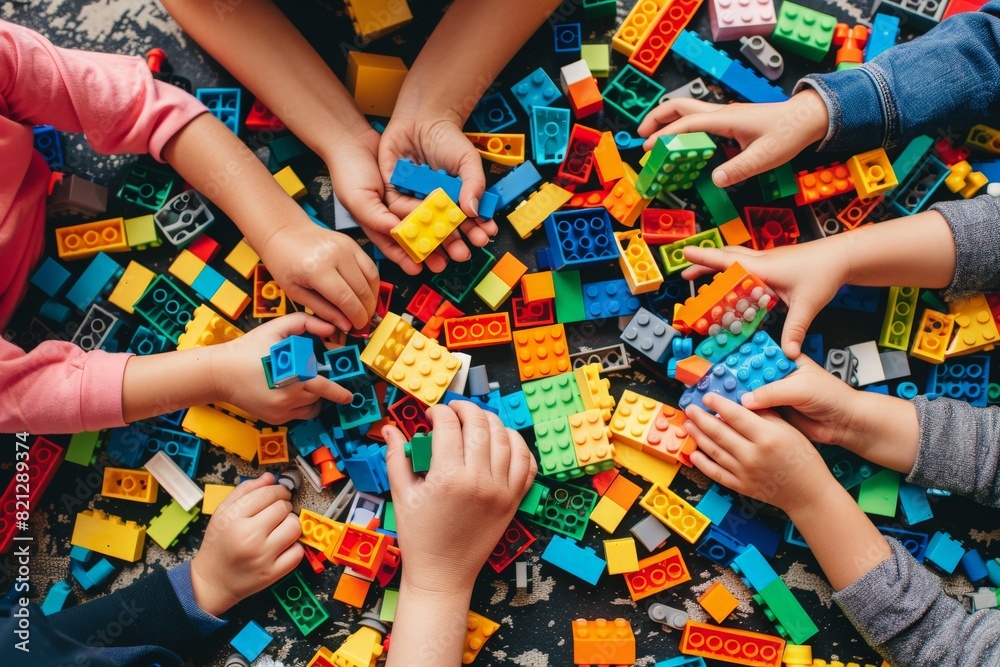 Wall mural a group of children engrossed in building and playing with colorful blocks, fueled by boundless crea