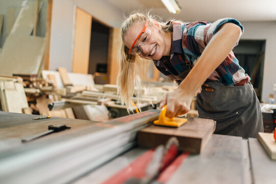 professional artisan carpenters woodworking team work together creatively, creative carpenter woman working workshop for wooden craft with wood tool at industry carpenter's shop, business of wood