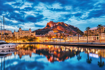 Illuminated Alicante Old Town Panorama at Dusk with Santa Barbara Castle and Harbor