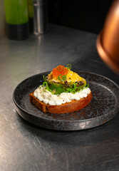 Toast with avocado and red caviar