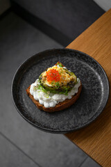 Toast with avocado and red caviar