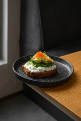 Toast with avocado and red caviar