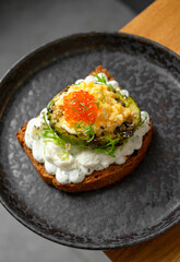 Toast with avocado and red caviar