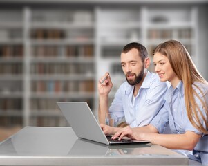 Young business person working on project with computer