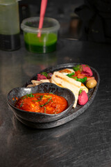Mediterranean mix with halloumi, vegetables, and pita bread