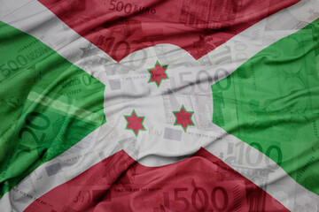 waving colorful national flag of burundi on a euro money banknotes background. finance concept.
