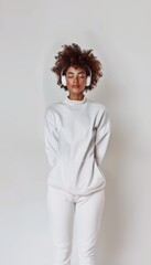 Obraz premium Slender young African American woman listens to music. Music for relaxation and training. Personal time, peace.