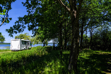 Magnificent landscape of Lake Soustons in southwest France with a camper van.