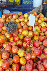 Big Bunch of Fresh Pomegranate Fruits at Farmers Market Stall in Turkey
