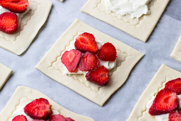 Puffs with strawberries and strawberries. The process of making summer dessert