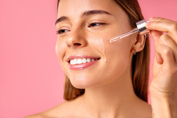 Fototapeta premium Cosmetology, beauty and spa treatment. Woman in lingerie on pink background.
