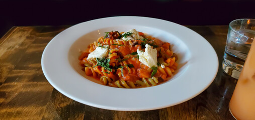 Octopus Fusilli  dish with red wine-braised octopus, pomodoro, ricotta, basil, pasta, Italian,...