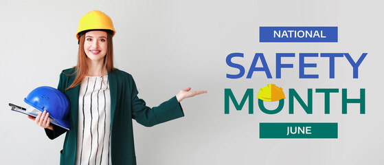 Female engineer showing something on light background