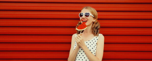 happy smiling young woman with fresh juicy fruits, lollipop or ice cream shaped slice of watermelon
