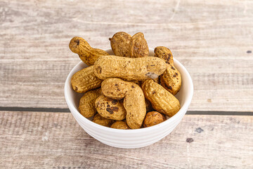 Raw ripe unpeeled peanut heap