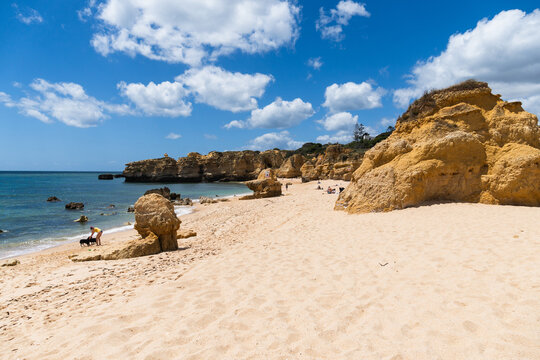 S&atilde;o Rafael beach, Albufeira, Algarve, Portugal. Sunny day. Rocks and cliffs on the beach. Crystal clear sea