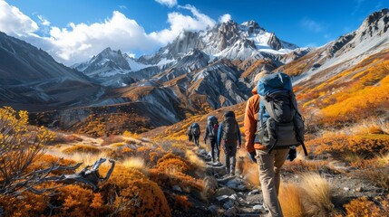 Group of People Hiking Up Hill With Mountains in Background