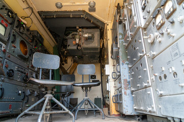 Old abandoned rusty military truck interior.