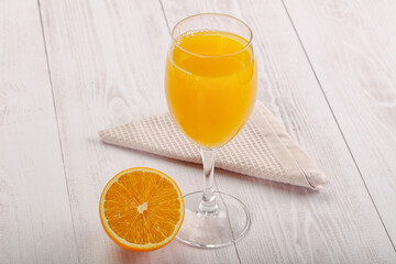 Sweet fresh orange juice in the glass