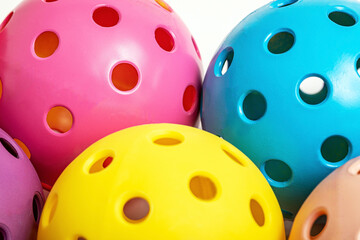 Colorful Pickleballs...Yellow, Blue, and Pink Pickleballs...Close-up