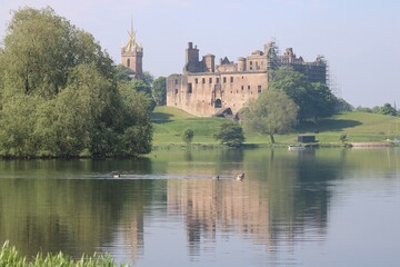 Looking across Linlithgow Loch from Fiddlers Croft towards St Michael's Church and the Palace. © Calum Smith