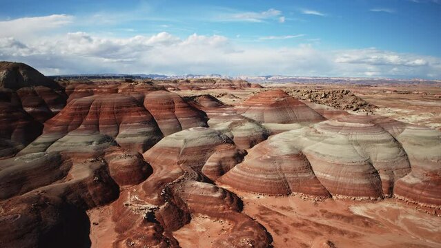 Aerial flyover view of colorful Bentonite Hills / Caineville, Utah, United States