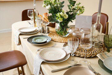 Beautiful table setting with eustoma flowers for wedding celebration in room, closeup